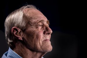 Senior man with hearing aid